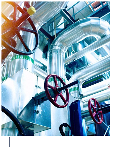 A close up of pipes and valves in an industrial setting.